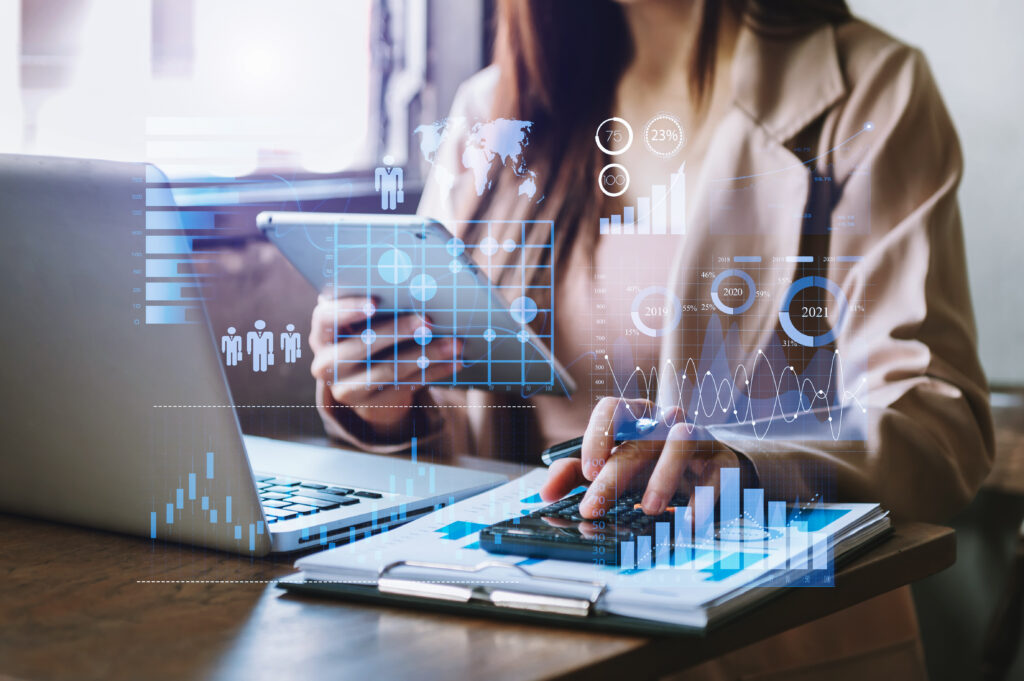 business operations balance sheet working with laptop computer, tablet and smart phone in office